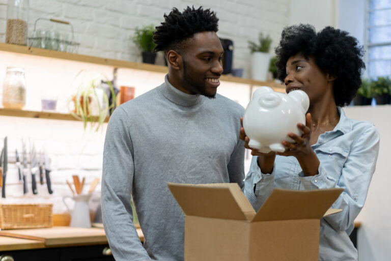 Couple Receiving A Piggy Bank