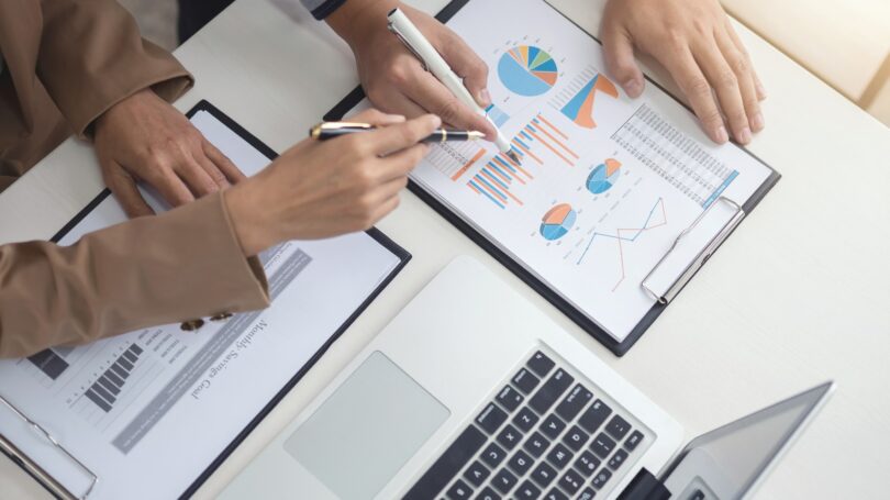 Financial Planning Discussing Chart Laptop Graph