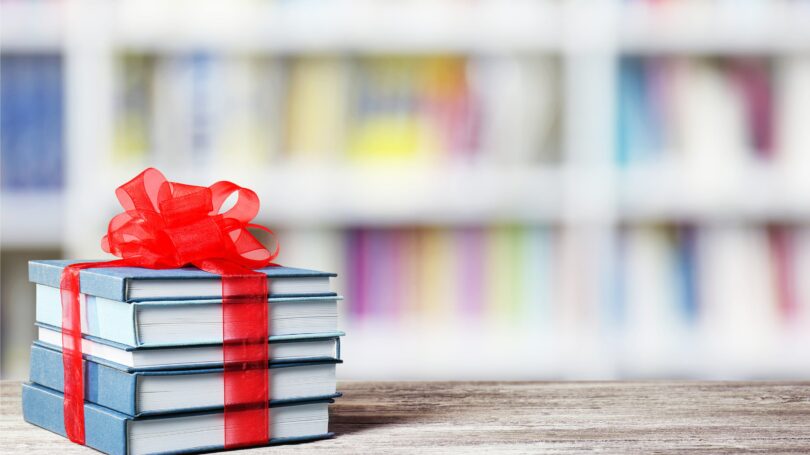 Stack Of Books With Ribbon Gift