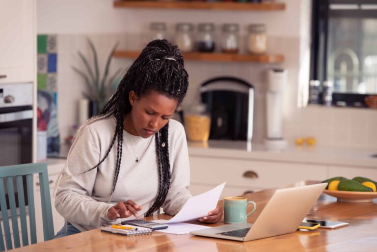 Woman Calculating Different Loans